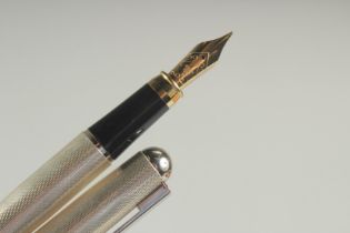 A STERLING SILVER FOUNTAIN PEN, BOXED.