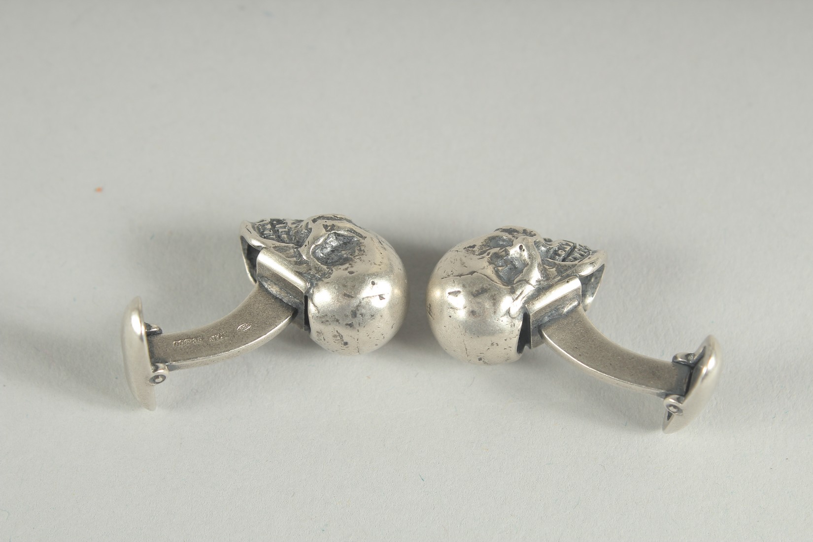 A PAIR OF HALLMARKED SILVER SKULL CUFF LINKS. - Image 2 of 2