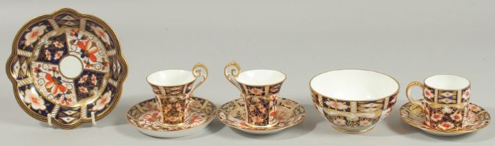 ROYAL CROWN DERBY. TRUMPET SHAPED DEMI-TASSEE, PAIR OF COFFEE CUPS AND SAUCERS with high handles.
