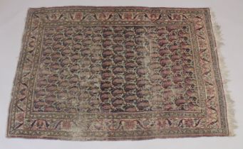 A PERSIAN RUG with many gulls 69ins x 48ins.