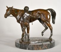 Priscilla Hann (b. 1943), a patinated bronze of a racehorse being unsaddled by a jockey, signed P.