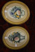 A pair of Chinese pith paintings depicting flowers in a vase, oval in gilt frames together with a