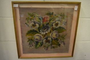 A bead work and wool work panel depicting roses, framed and glazed.