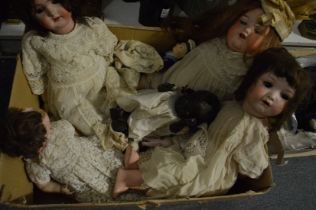 A collection of Victorian and other porcelain headed dolls.