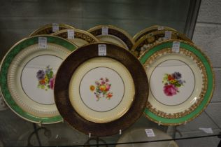 A collection of eight paragon and other floral decorated cabinet plates.