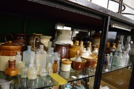 A collection of old stoneware and glass bottles, jars etc.