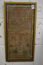 A sampler, probably 19th century, with alphabet, peacocks and other items, signed J A Menzies, 7.
