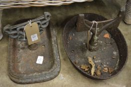 Two cast iron boot scrapers.