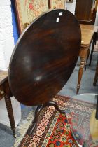 A 19th century mahogany tilt-top circular tripod table with bird cage action.