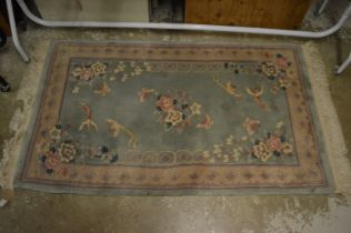 A Chinese green ground rug 160cm x 90cm.