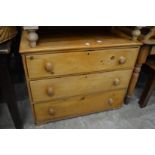 A pine three drawer chest.