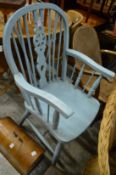 A painted wheel back armchair.