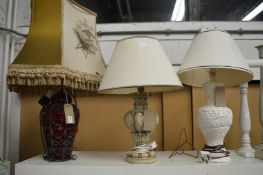 Three decorative table lamps.