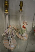 A pair of Dresden porcelain figural table lamps.