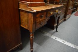 A 19th century mahogany washstand with a single central drawer flanked by a pair of deep drawers