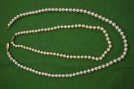 Two pearl necklaces.