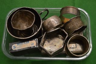 A small group of silver items.