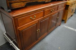 A Chinese red wood sideboard.