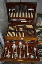 A mahogany cased twelve place canteen of cutlery.