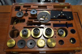 Mahogany cased microscope lenses.