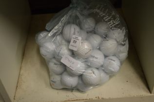 Fifty Titleist golf balls.