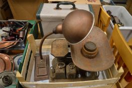An old desk lamp, cast iron kitchen scales and weights and an early projector.
