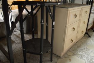 Ebonised occasional table and pair of bedside chests.