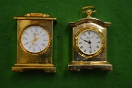 Two miniature clocks.