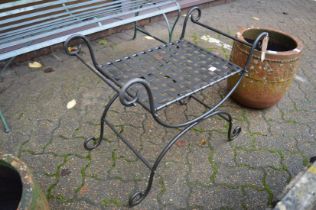 A wrought iron seat.