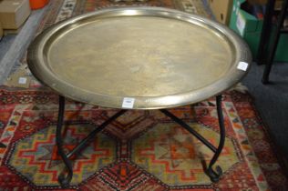 A brass tray table.