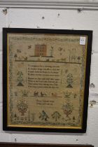 A good 19th century sampler with numerous figures, buildings, animals, birds and text, signed