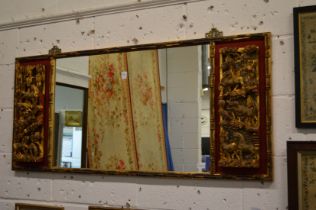 A good Chinese rectangular mirror with carved and gilded decoration to each end depicting horses
