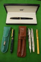 A Mont Blanc roller ball pen, boxed, a Cartier fountain pen, a Lynx pen set and a Michel Jordi pen