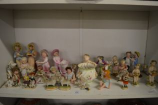 A group of Continental porcelain figures of children and other items.