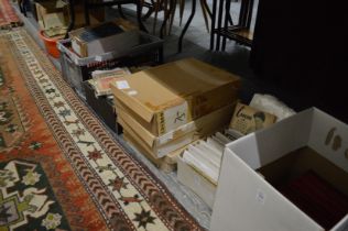 A large quantity of books and ephemera to include postcards, cigarette cards etc.