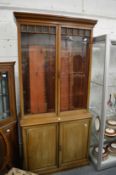A Victorian mahogany cupboard bookcase.