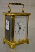 A brass carriage clock.