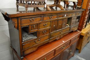 A Chinese low altar style multi-drawer chest.