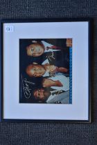 Boxing interest, a colour photographic print signed by Muhammad Ali, Joe Frazier and George