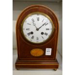 An Edwardian inlaid mahogany mantle clock.