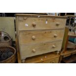 A pine three drawer chest.