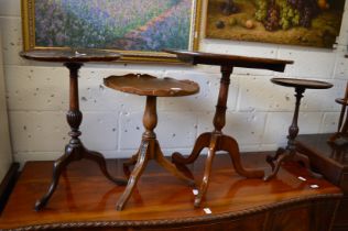 Four various mahogany tripod tables.