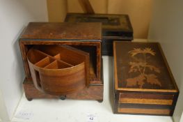A burr wood cigarette dispenser and two other boxes.