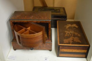 A burr wood cigarette dispenser and two other boxes.