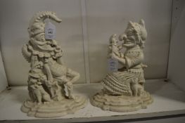 A pair of Punch and Judy cast iron door stops.
