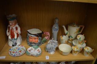 A shelf of decorative china.