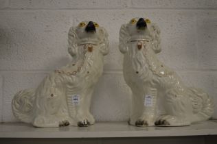 A pair of Staffordshire spaniels.