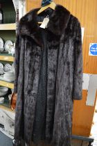 A ladies fur coat.