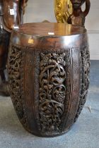 A pair of carved wood barrel shaped seats or stands.