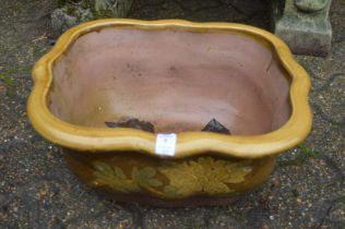 Three glazed plant pots.